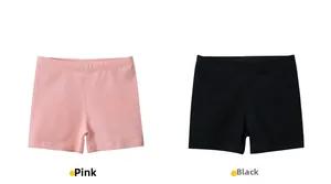 Flat lay of pink and black cotton safety shorts for girls with elastic waistband