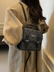 British style grey herringbone backpack with black polka dots and silver bow decoration
