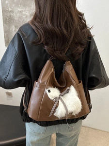 Brown soft leather multi-functional backpack with cute plush dog pendant accessory