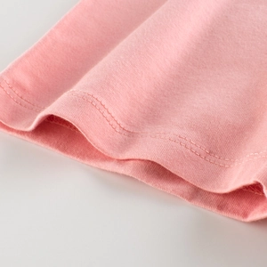 Pink cotton girls leggings showing close-up of knit fabric and double-needle stitching