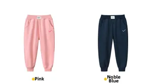 Detail of pink and navy kids' cotton jogger pants showing elastic waist and embroidery