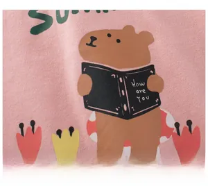 Detail of pink cotton fabric with cute capybara print and floral patterns for girls top