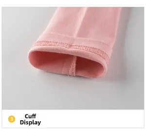 Close-up of pink girls long sleeve shirt showing rib-knit cuffs and stitching details