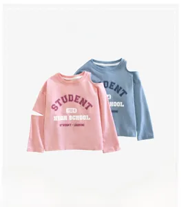 Detail of girls' cotton long sleeve tee with trendy cold shoulder and varsity print