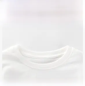 Close-up of the round neckline and stitching on a white cotton long-sleeve kids' shirt