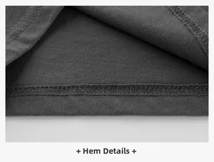 Detailed macro view of boys dark grey cotton knit long sleeve shirt hem stitching