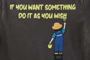 Detail of dark grey kids T-shirt with yellow slogan and painter illustration print