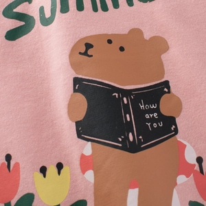 Pink cotton T-shirt for girls featuring a cute cartoon capybara and floral print