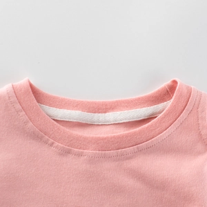 Pink cotton long sleeve t-shirt for girls featuring a ribbed round neckline and soft texture