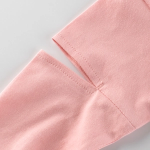 Close-up of pink long-sleeve cotton T-shirt featuring high-quality stitching on the cuffs