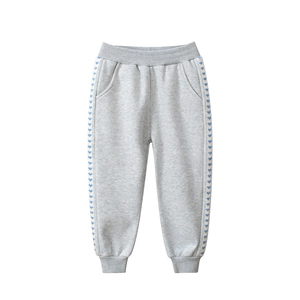 Kids grey heart-patterned jogger pants with elastic waist and ribbed ankle cuffs