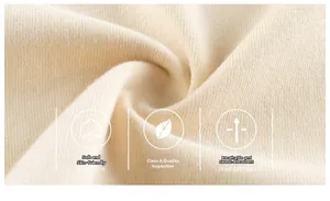 Macro shot of soft breathable A-grade knit fabric in cream color for kids clothing