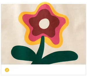 Close-up of retro floral print on soft cream cotton fabric of a girl's long sleeve tee