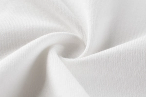 Gros plan sur la texture du tissu en maille de coton blanc doux et extensible