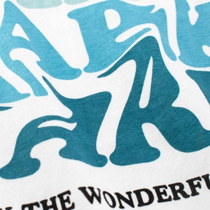T-shirt manches longues enfant en coton blanc avec imprimé graphique ondulé bleu et texte