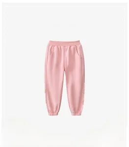 Detail view of pink girls joggers featuring elastic waist and cute bear graphic print