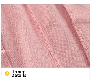 Detailed macro view showing high-quality flatlock stitching inside pink cotton joggers