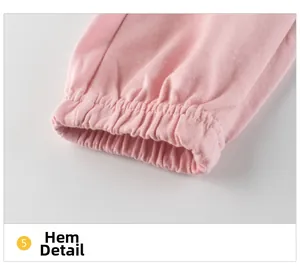Close-up of pink cotton knit pants featuring elastic ribbed cuff details for toddlers