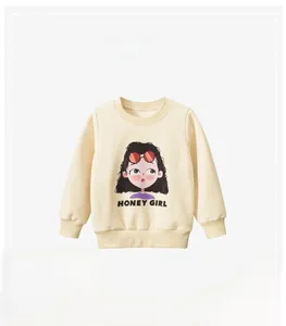 Detail of cream cotton kids sweatshirt featuring a cartoon girl and Honey Girl text print
