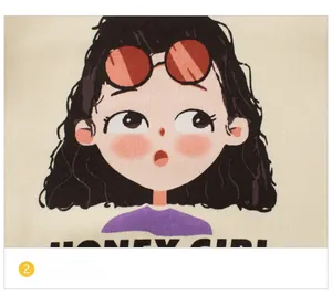 Close-up of cotton knit fabric with a colorful cartoon girl print and Honey Girl text