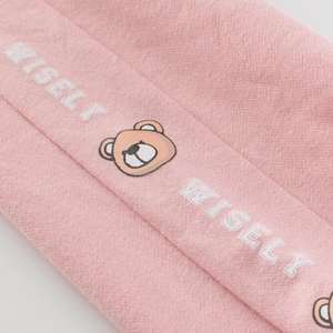 Pink cotton girls' sweatpants featuring a cute bear icon and white Wisely text design