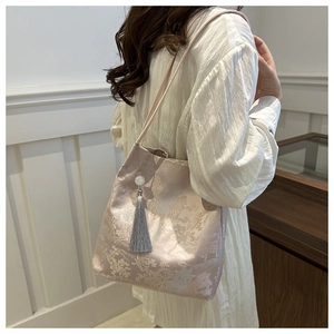 Detailed texture of jacquard silk fabric with traditional Chinese building patterns