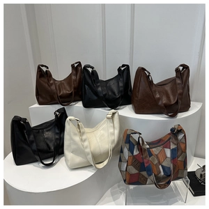 Detailed view of the large hobo bags showing leather texture and six color options