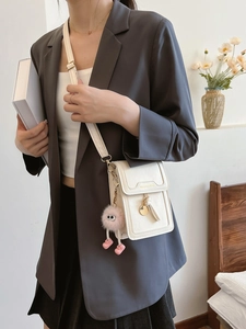 Chic cream white mini shoulder bag for women with cute pink plush charm and strap
