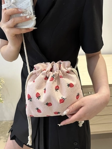 Cute pink strawberry print corduroy mini bucket bag with drawstring and white rope strap