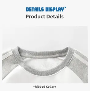 Detail view of ribbed neckline and fleece lining on grey and white raglan sweatshirt