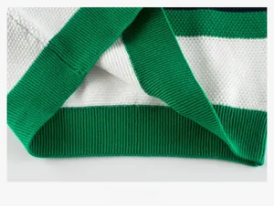 Detail of green and white striped waffle knit texture and ribbed hem for kids sweater