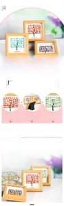 Detail of crystal tree photo frame with natural stones and Blossom text on desk