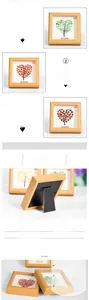Macro shot of heart-shaped natural crystal stone tree inside a wooden photo frame
