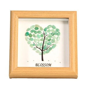 Square wood frame with heart-shaped green crystal stones and Blossom text art
