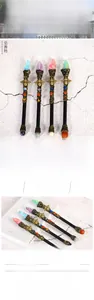Detailed set of four insect magic wands with natural crystals and ornate bee metal handles