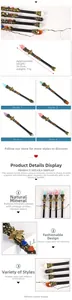 Detail view of 26.5cm healing wands with natural crystal stones and bee metal motifs