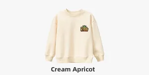 Detail of children's apricot sweatshirt featuring Cool Kids crown embroidery on chest