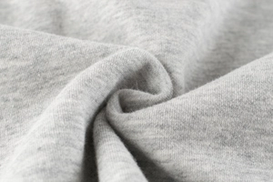Macro detail of high-density heather grey fleece fabric for children sweatshirt