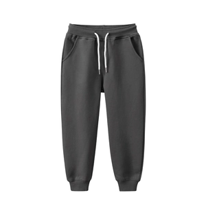 Pantalon de jogging gris foncé pour enfant avec cordon blanc et chevilles élastiquées