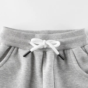 Kids warm fleece grey joggers featuring ribbed elastic waistband and drawstring detail