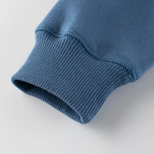 Blue ribbed cuff of a Korean style kids sweatshirt featuring high quality knit fabric
