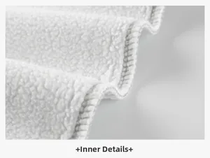 Detailed close-up of thick white fleece lining with high-quality reinforced stitching