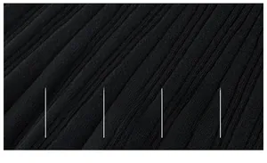 Macro view of breathable black ribbed knit fabric showing soft texture and high-quality weave