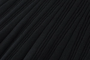 Close-up of the black ribbed knit fabric showing detailed vertical texture and soft fiber