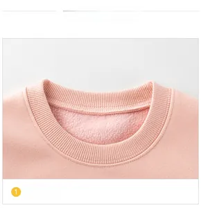 Close-up of pink fleece lining and ribbed neckline on children's warm sweatshirt