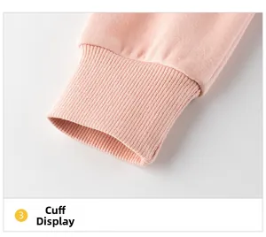Close-up of pink ribbed knit cuff on a warm fleece-lined sweatshirt for kids