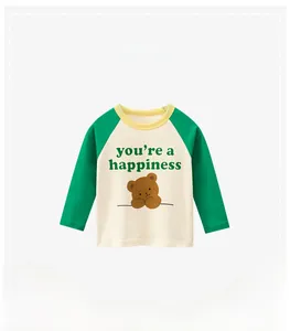 Detail of kids raglan long sleeve tee featuring green sleeves and bear print