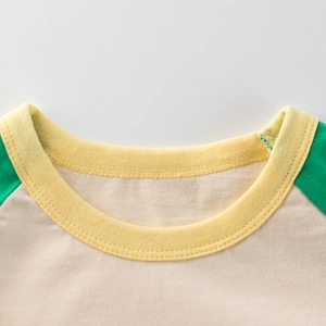 Kids long sleeve raglan T-shirt with yellow ribbed crew neck and green patchwork sleeves