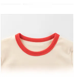 Detail view of cotton t-shirt collar featuring red ribbed trim and precise stitching
