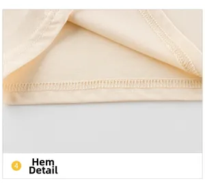 Vue détaillée de la couture plate à double aiguille sur l'ourlet du T-shirt enfant en coton